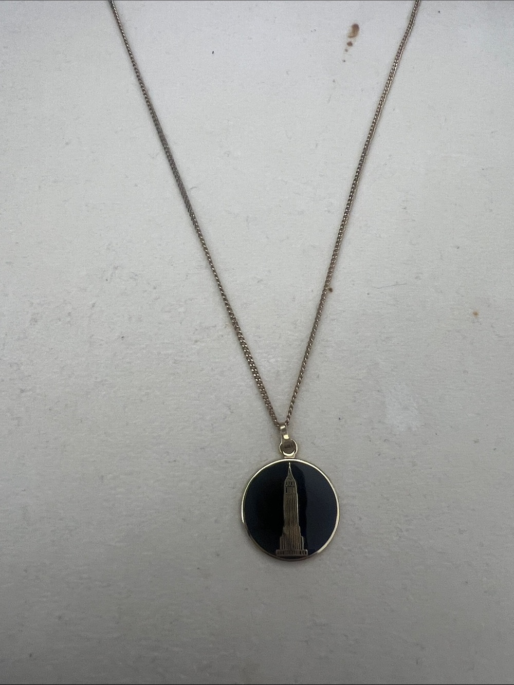 Gold Tone Pendant Necklace with Black Enamel and Tower Motif